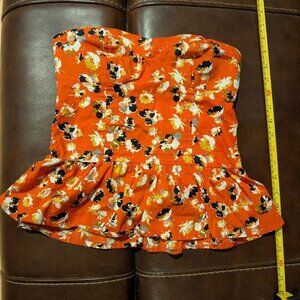 Cute Orange Smocked Floral XHILARATION Strapless Top, it has Ruffles. Size XS